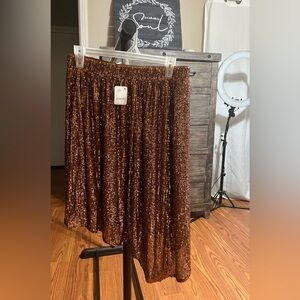 NWT. Free People Brown asymmetrical sequin skirt size small ( $retail 128.00)
